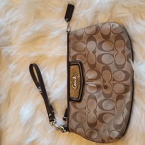 Coach wristlet,  good condition, small spot on front but can be cleaned